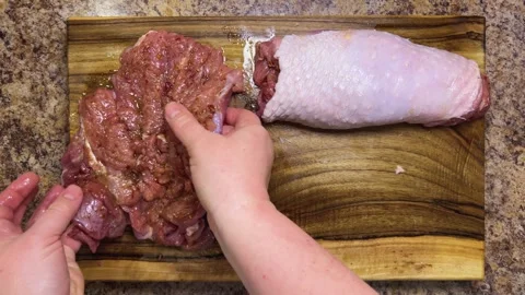 Preparing the turkey thigh for the roulade. Stock Footage 328295927