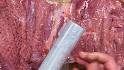 Preparing the turkey thigh for the roulade. Stock-Footage 328599735