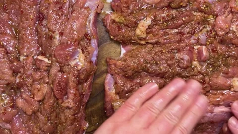 Preparing the turkey thigh for the roulade.  Stock-Footage 328600568