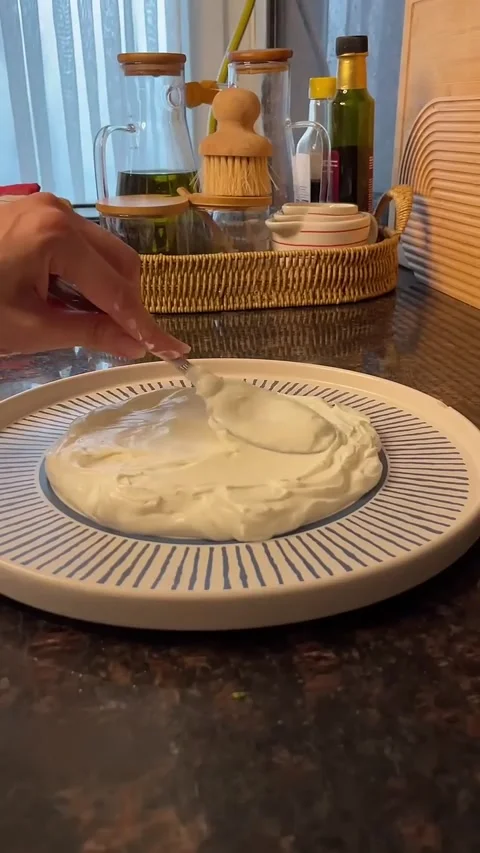 Preparing Turkish Cacik with Yogurt and Shredded Cucumber Stock Footage 343605644