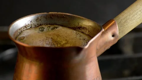Preparing turkish coffee in copper cezve on gas stove. Stock Footage 148823576