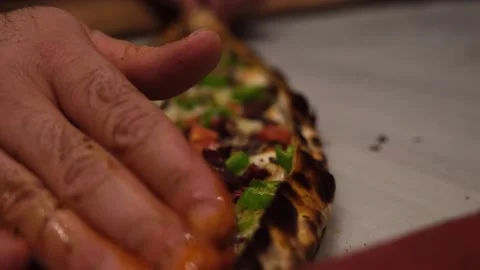 Preparing Turkish pita pide for serving Stock Footage 164118685