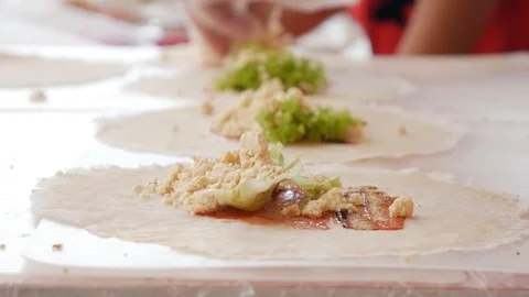 Preparing vegan spring roll at street market, asian cuisine. Closeup. 4k Stock Footage 112912795