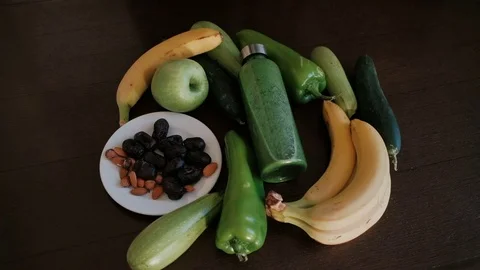 Preparing for vegetable green smoothie in the kitchen. Stock Footage 84947218