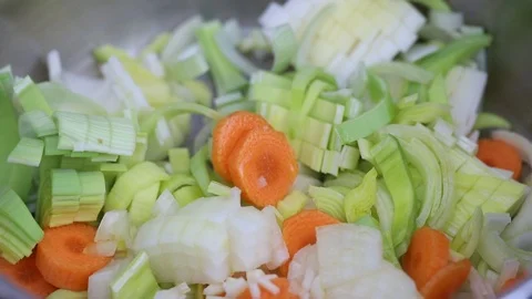 Preparing vegetable soup in iron pot Stock Footage 107180949
