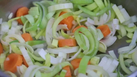 Preparing vegetable soup in iron pot Stock Footage 107182521