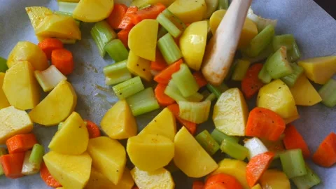Preparing vegetables carrots, potatoes and celery for baking Stock Footage 138962057