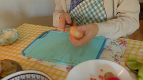 Preparing Vegetables in Kitchen with Knife and Cutting Board Stock Footage 318925534