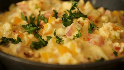 Preparing vegetables omelette on frying pan Stock Footage 198179945