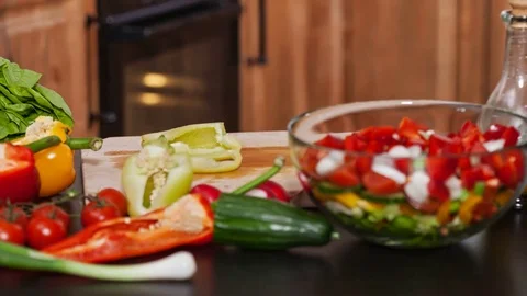 Preparing vegetables salad - stop motion with moving camera Video stock 73916837