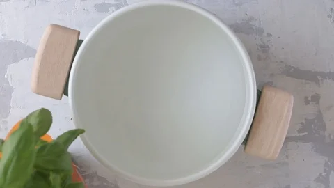 Preparing vegetables in water in pot Stock Footage 120016026