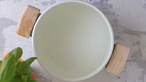 Preparing vegetables in water in pot Stock Footage 120016566