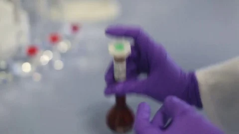 Preparing Vials and Liquid for Pipette Extraction Stock Footage 69088096
