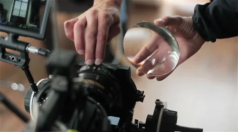 Preparing video camera for shooting. Changing lens of red camera. Close-up Stock Footage 55738640