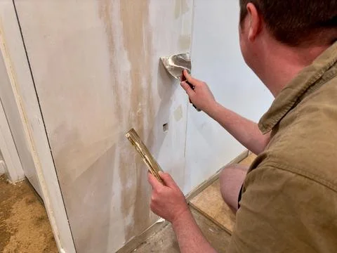 Preparing a Wall for Painting with Plaster Stock Photos