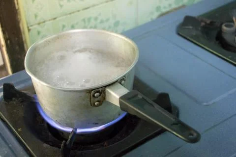 Preparing a warming drink Stock Photos
