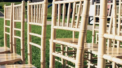 Preparing for the wedding, chairs for guests, chairs are in a row Stock Footage 260895342