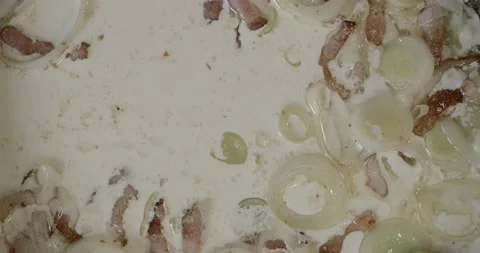 Preparing white boiling carbonara sauce in a hot pan, 4k, close up, timelapse 스톡 동영상 228860632