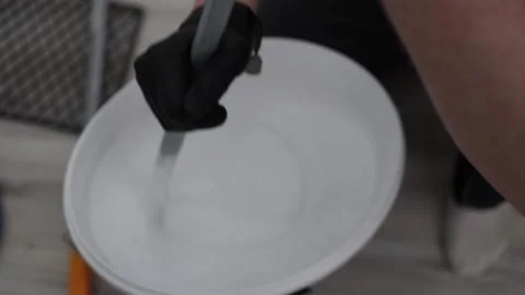 Preparing white paint for wall repair Stock Footage 335039571