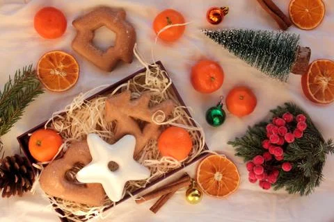 Preparing winter holidays gift box with Christmas gingerbread cookies Stock Photos