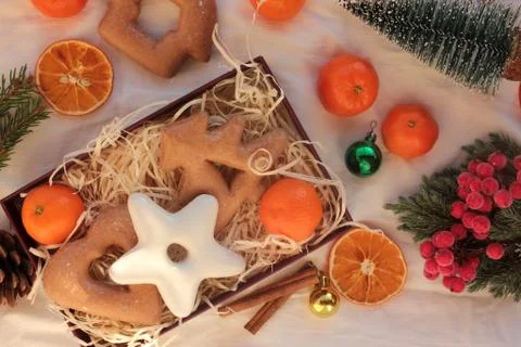 Preparing winter holidays gift box with Christmas gingerbread cookies Stock Photos