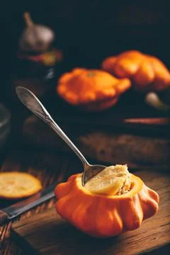 Preparing yellow pattypan squash for stuffing Stock Photos