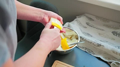 Preparing Yellow Squash Slices in Bright Home Kitchen by Window Light Stock Footage 338152476