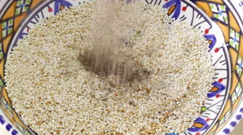 Preparing za'atar, a Middle Eastern blend of herbs, sesame seeds and sumac Stock Footage 62685466