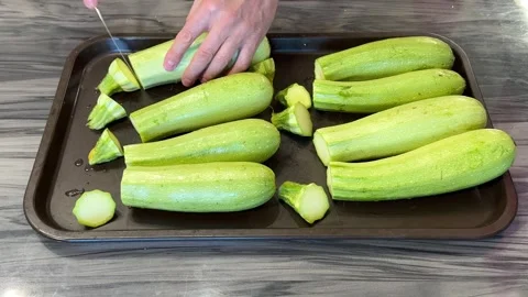 Preparing zucchini for storage or cooking, slicing and organizing them for fu Video stock 303359294