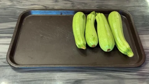 Preparing zucchini for storage or cooking, slicing and organizing them for fu Video stock 307219001
