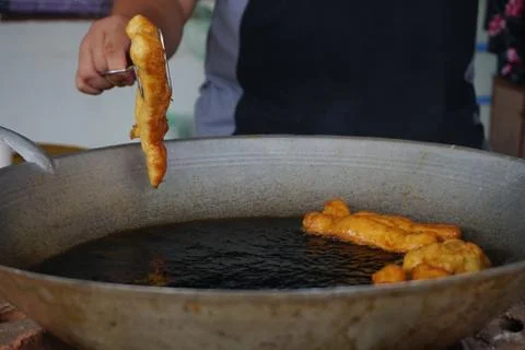 Prepation of Fried bread stick, Cakwe , the bread is also popularly known as  Stock Photos