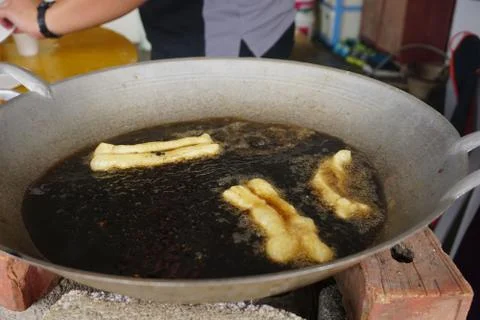 Prepation of Fried bread stick, Cakwe , the bread is also popularly known as  Stock Photos