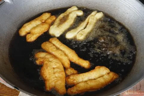 Prepation of Fried bread stick, Cakwe , the bread is also popularly known as  Stock Photos