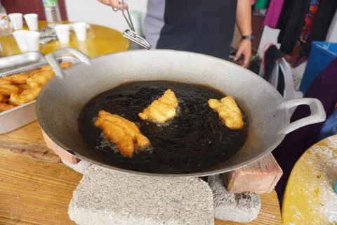 Prepation of Fried bread stick, Cakwe , the bread is also popularly known as  Stock Photos