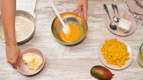 Prepearing of tasty receipt of mango pie with cream Stock Footage 94158537