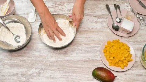 Prepearing of tasty receipt of mango pie with cream Stock Footage 94159142
