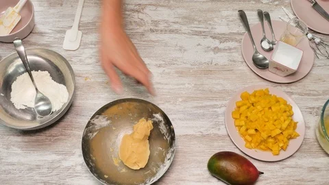 Prepearing of tasty receipt of mango pie with cream Stock Footage 94159333
