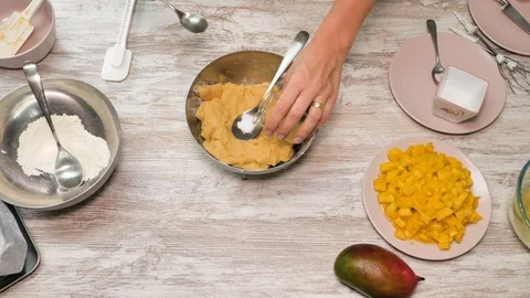 Prepearing of tasty receipt of mango pie with cream Stock Footage 94159461