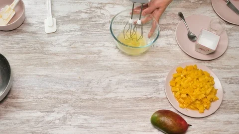Prepearing of tasty receipt of mango pie with cream Stock Footage 94159506