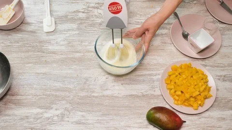 Prepearing of tasty receipt of mango pie with cream Stock Footage 94159548