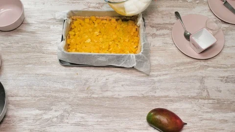 Prepearing of tasty receipt of mango pie with cream Stock Footage 94159714