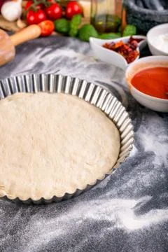 Prepering pizza dough for baking Stock Photos