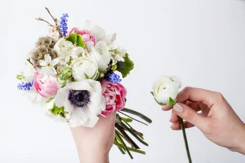 Prepering spring bouquet in hands Stock Photos
