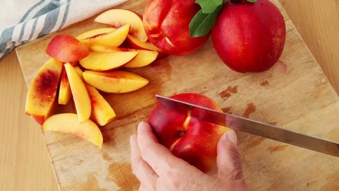 Prepping fresh summer nectarines Stock Footage 98517613