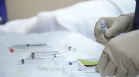 Prepping Syringes by the Operating Table Stock-Footage 62805898