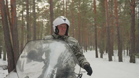 Preride gear check routine. Ensuring safety before snowmobiling adventure Stock Footage 334800619