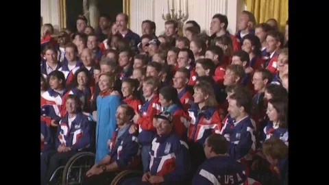 Pres. Clinton stands with U.S. Winter Olympic athletes for a photograph - 1994 Stock Footage 90454498