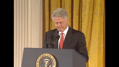 Pres. Clinton talks to the guests present at Hate Crime Legislation - 1997 Stock Footage 90455037