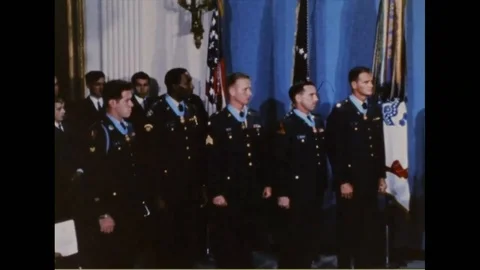Pres. Lyndon Johnson honoring five soldiers during medal of honor ceremony- 1968 Stock Footage 93002240