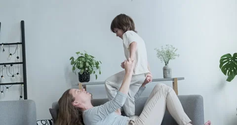 Preschool boy kid having fun with mother, jumping and goofing around. It's fun Stock Footage 163442018